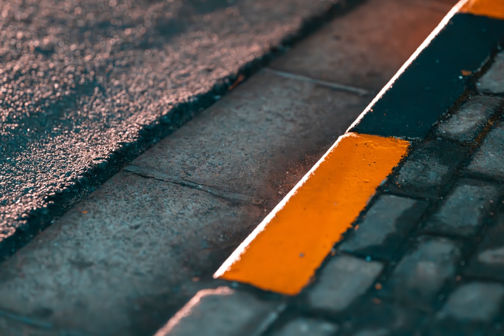 a close up of a street with a yellow line painted on it