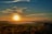 A picturesque landscape showcasing a stunning sunset at a travel destination.