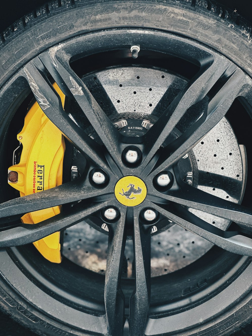 a close up of a yellow brake on a car