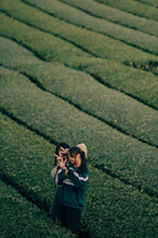 A friendly handshake between two farmers in a lush green field symbolizing partnership.