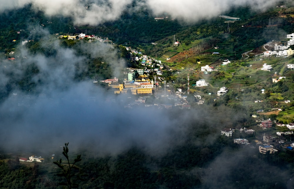 a view of a town from above the clouds