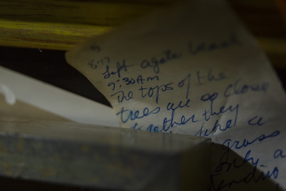 a close up of a piece of paper with writing on it