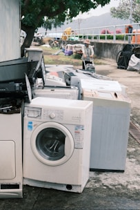 a pile of washing machines sitting next to each other