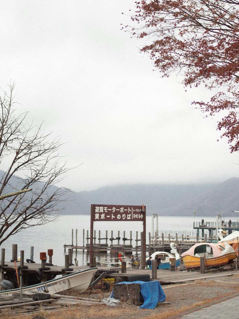 a group of boats sitting on top of a body of water