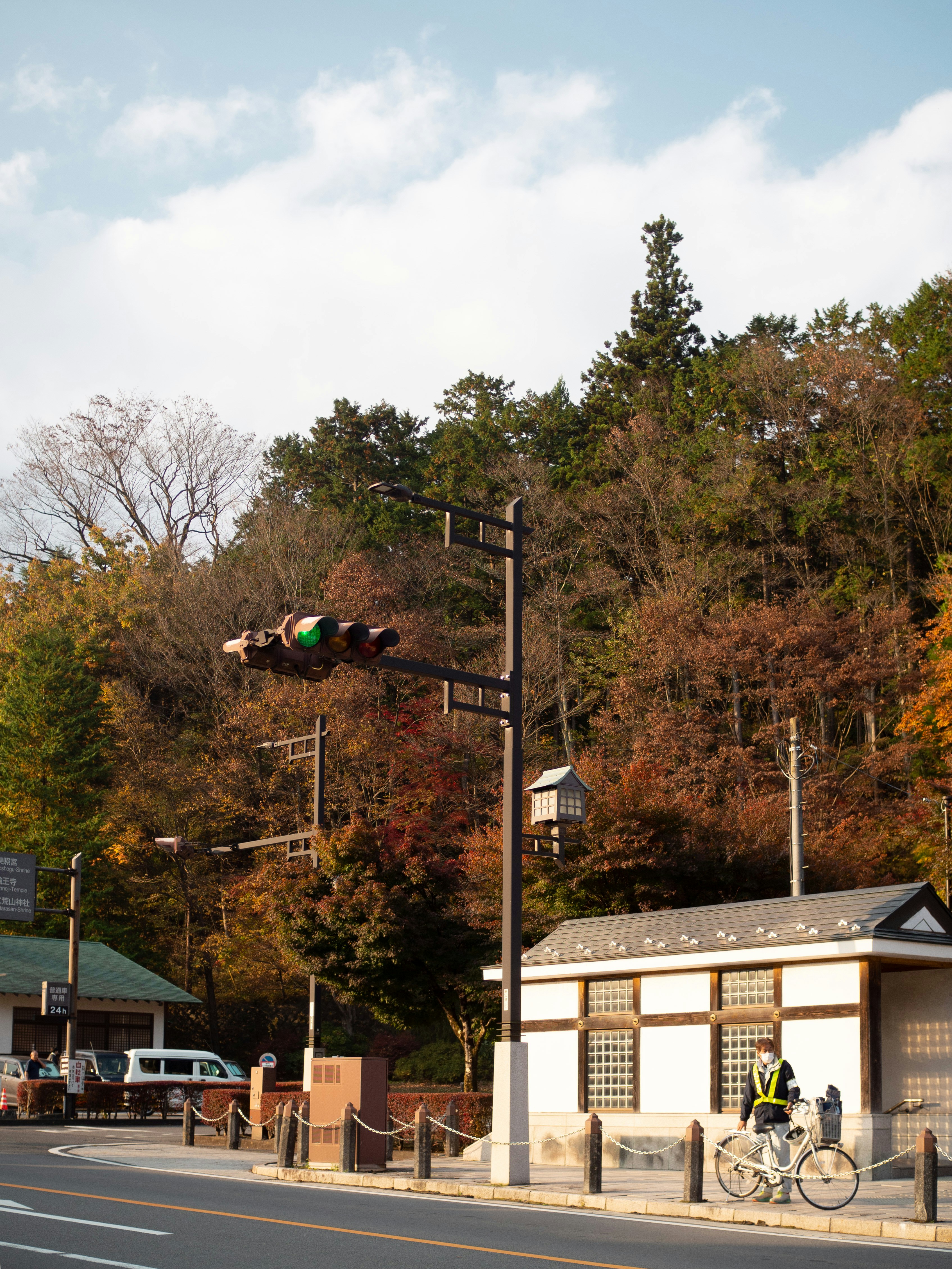 a person riding a bike on a city street