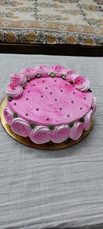 A simple yet stunning cake with a smooth pink frosting.
