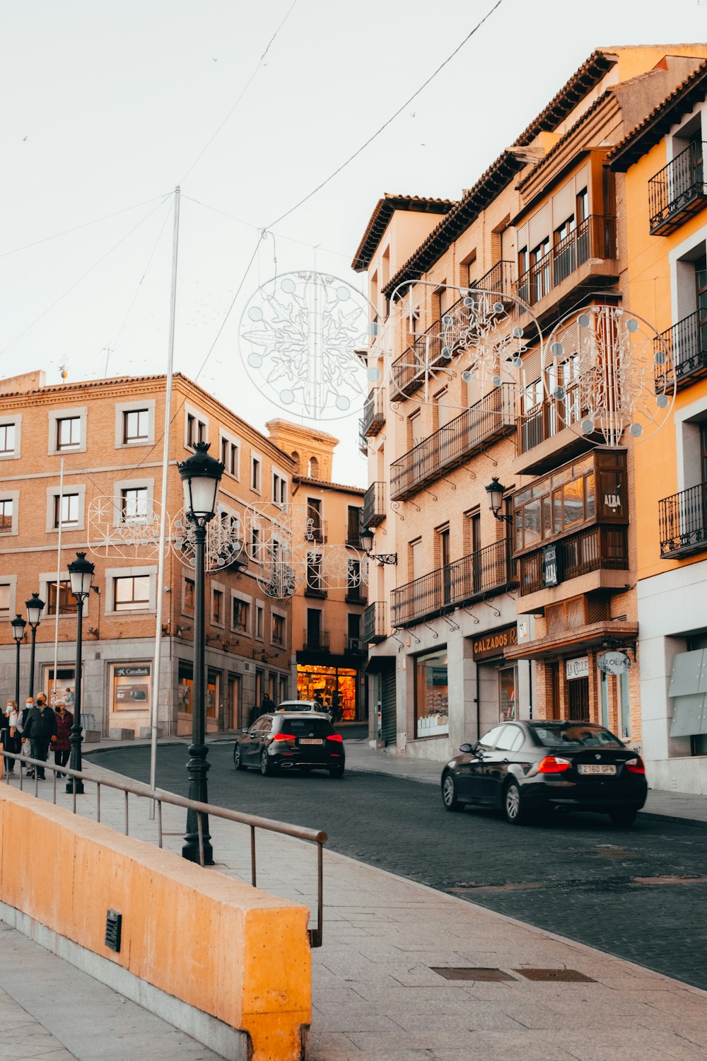 a city street with cars parked on the side of it