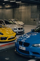 A panoramic view of a luxury car collection in a stylish private garage.