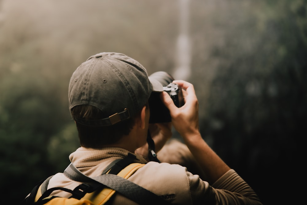 a man is taking a picture with a camera