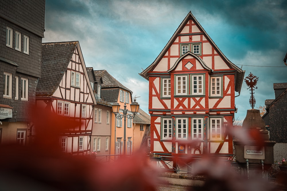 a red and white building with a clock on it