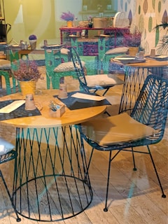 A vibrant cafe interior showcasing colorful seating and decor.