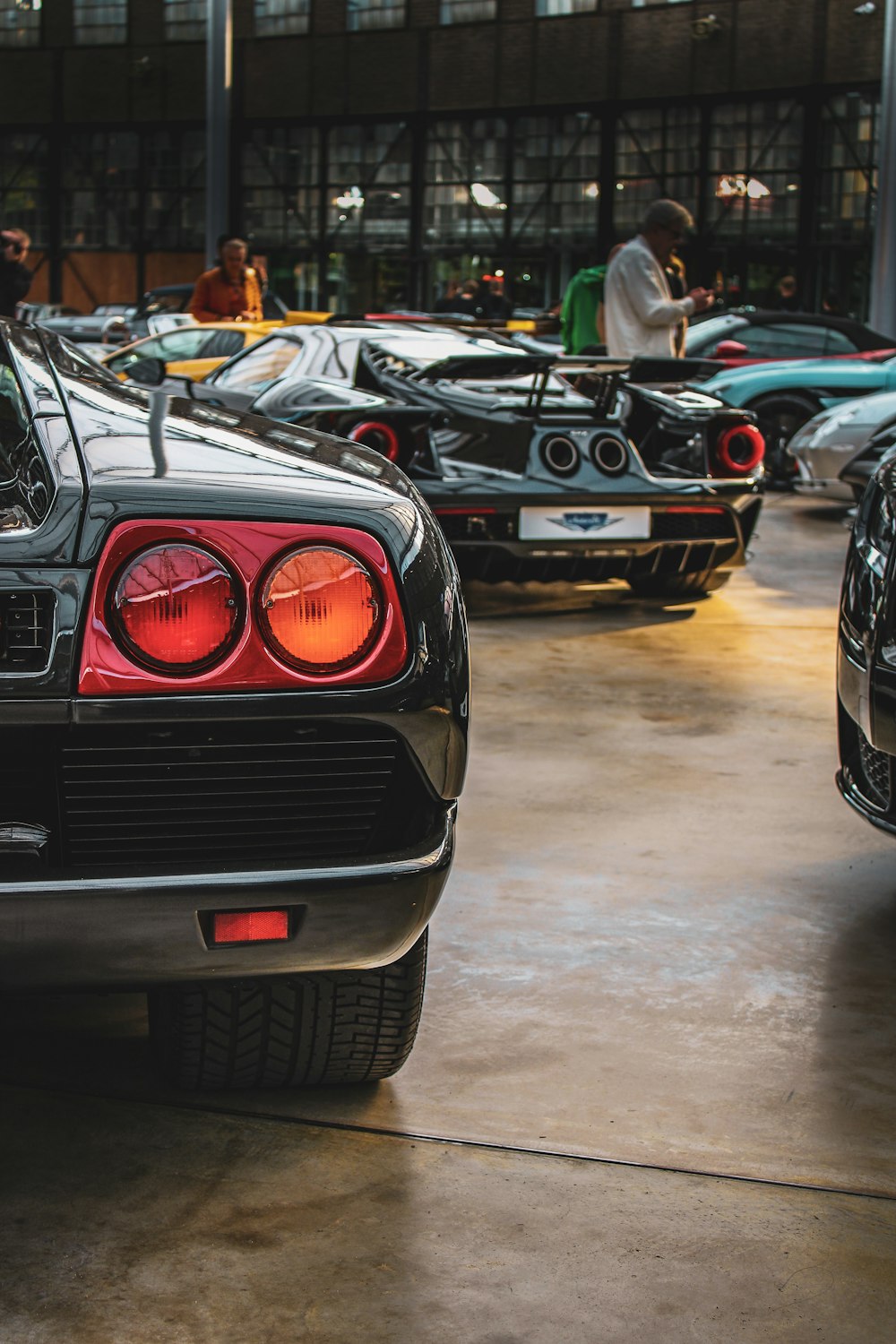 a group of cars parked in a garage