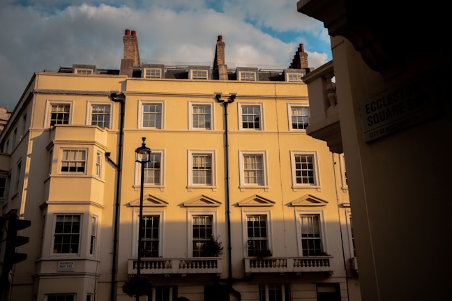 Charming exterior view of a classic London apartment building at dusk.