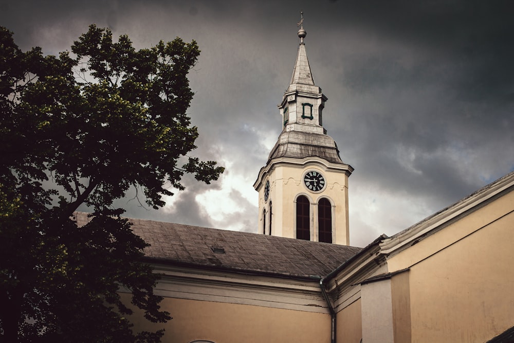 a church steeple with a clock on it