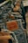 A close-up view of several pairs of Levi Strauss & Co. jeans hanging on metal hangers in a store. The focus is on the leather brand labels which are prominently displayed on the back of the jeans, with the classic Levi's logo and product information.