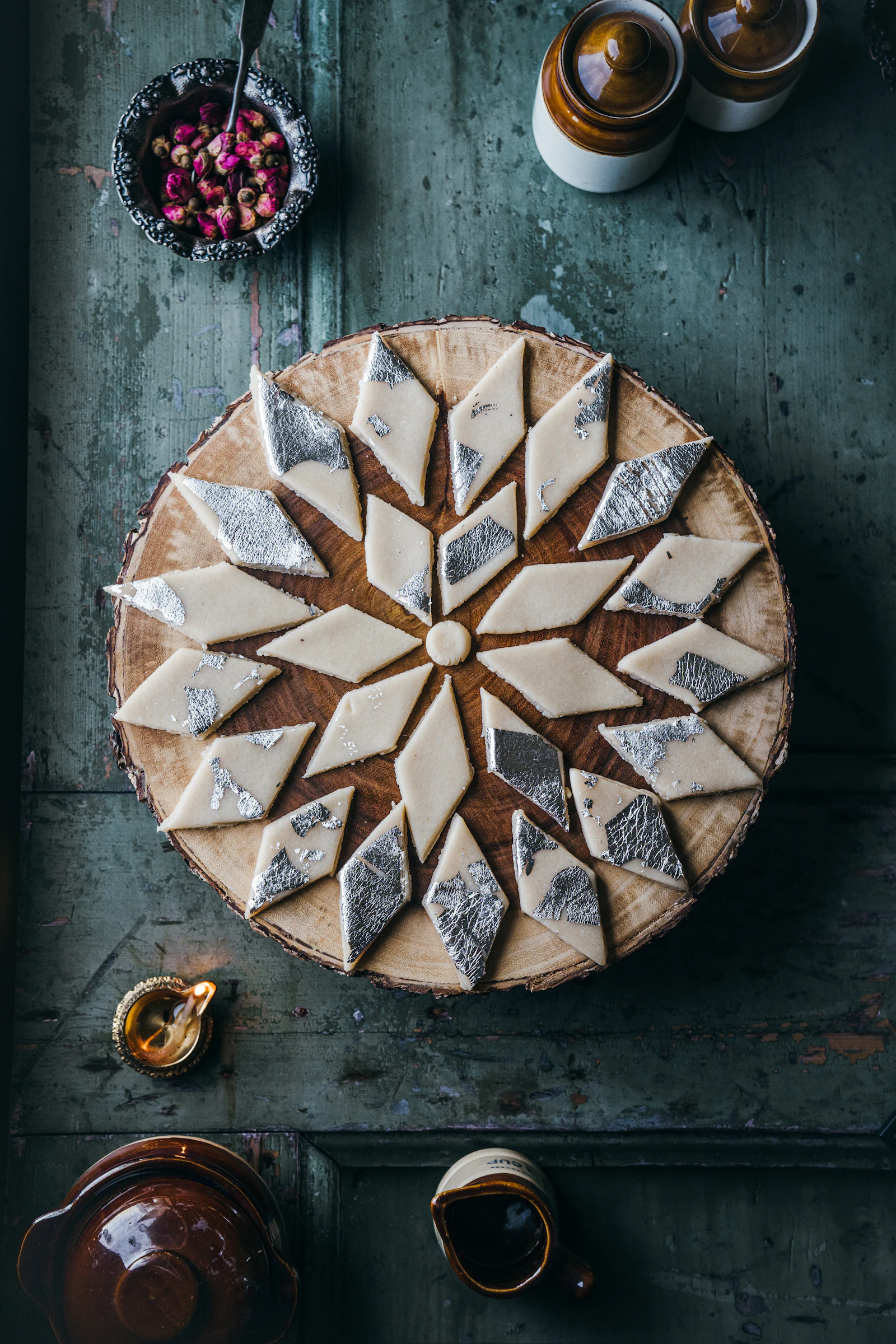 Diamond-cut kaju katli arranged in a ring on a plate