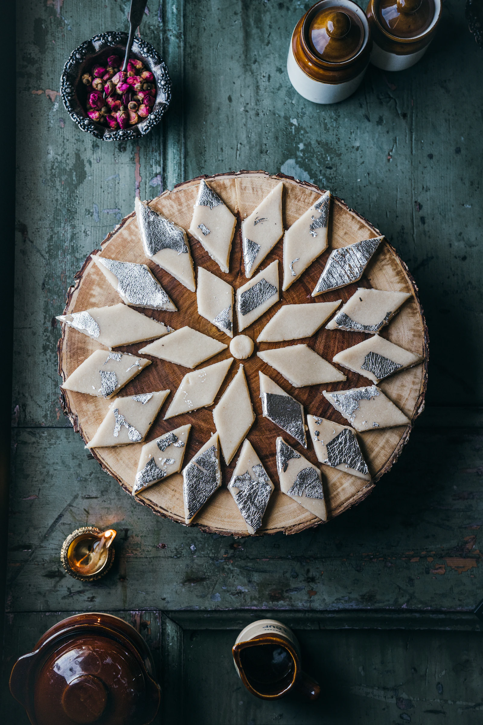 Diamond-cut kaju katli arranged in a ring on a plate