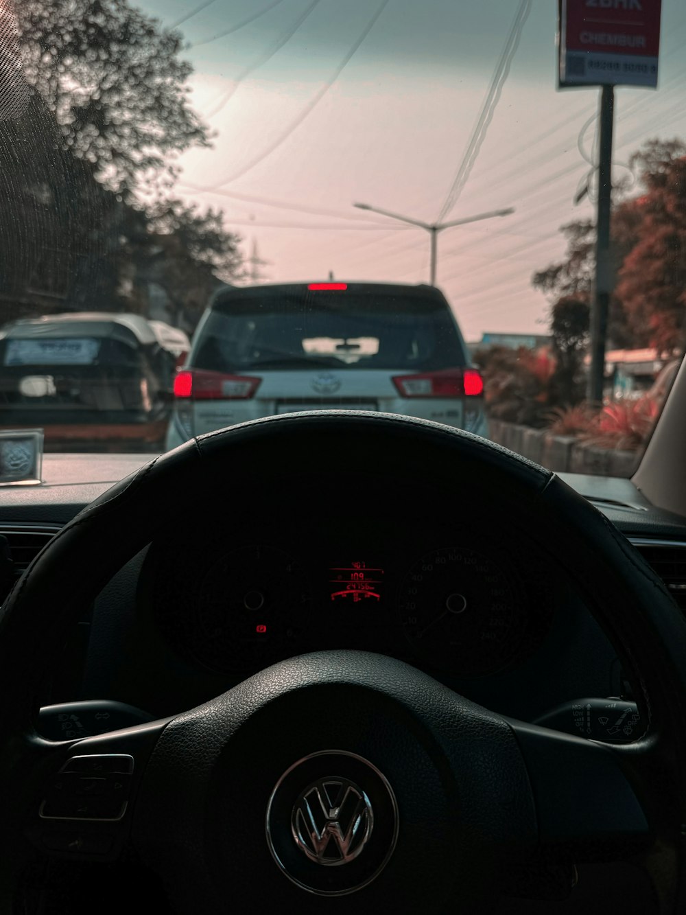a view of a dashboard of a car from inside a vehicle
