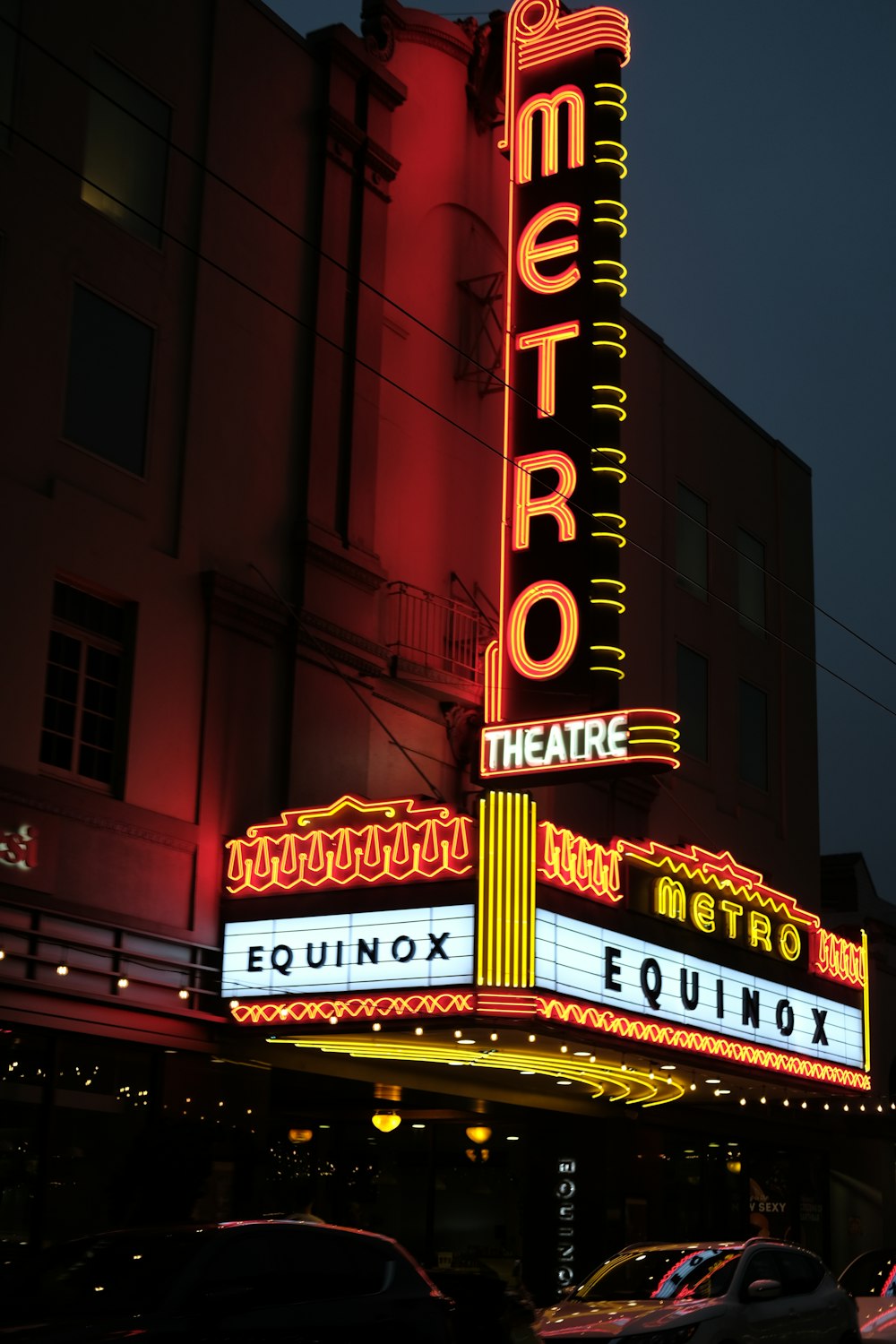 a theater marquee lit up at night