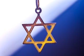 a star of david hanging from a chain