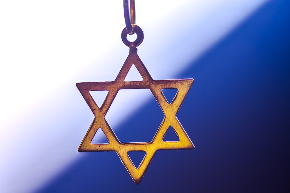 a star of david hanging from a chain