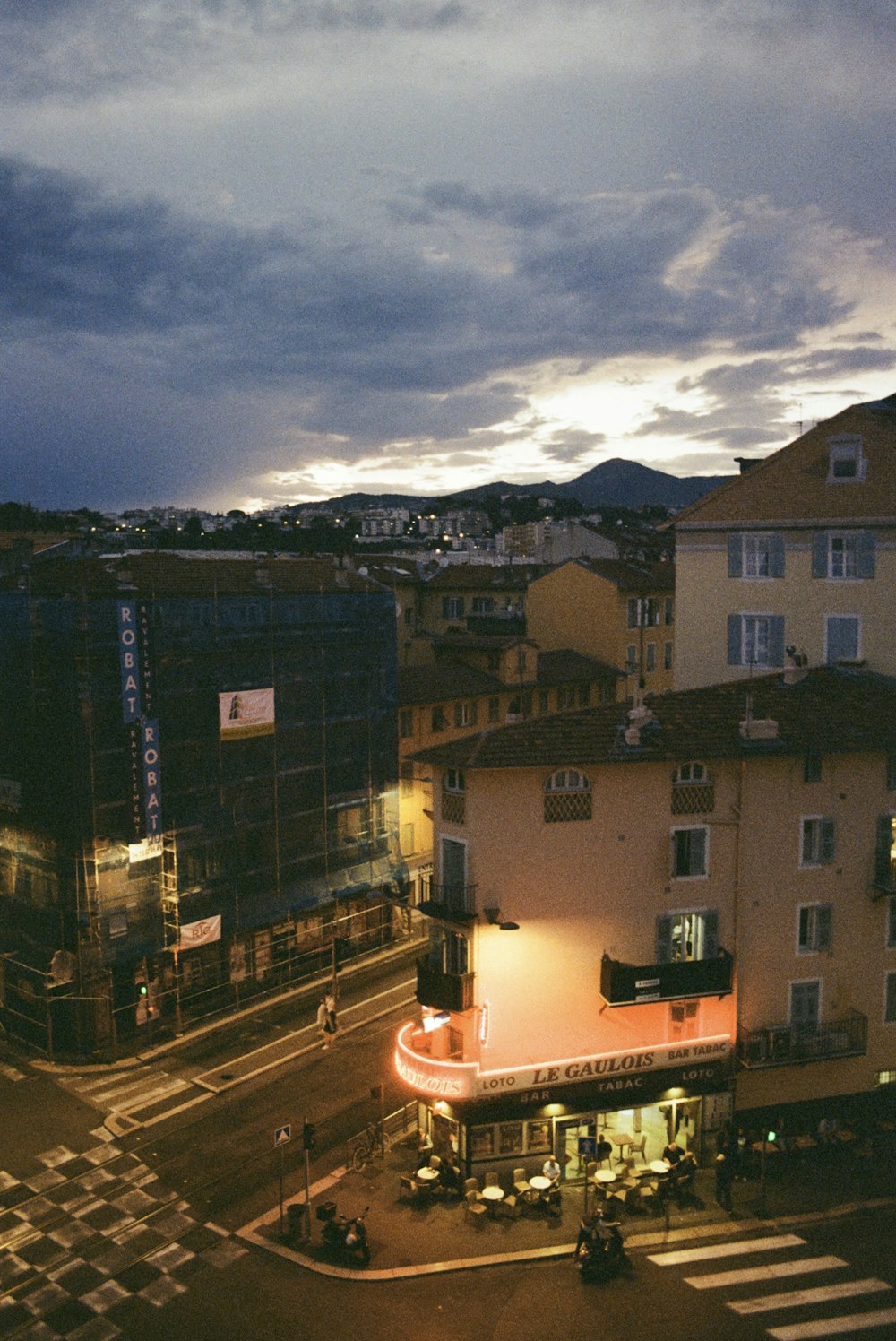 a view of a city street at dusk