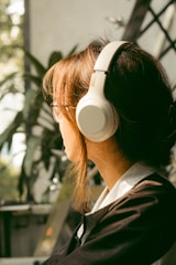 A serene audio setup with headphones and calming nature elements in the background.