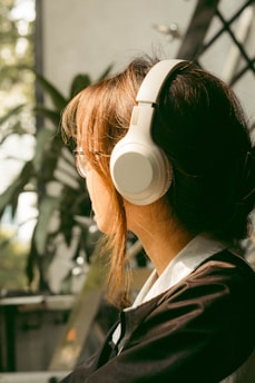 A serene audio setup with headphones and calming nature elements in the background.