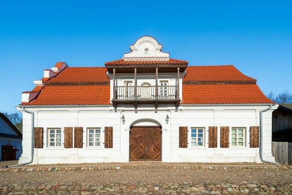A whitewashed manor in the open-air village museum — Lublin, Poland