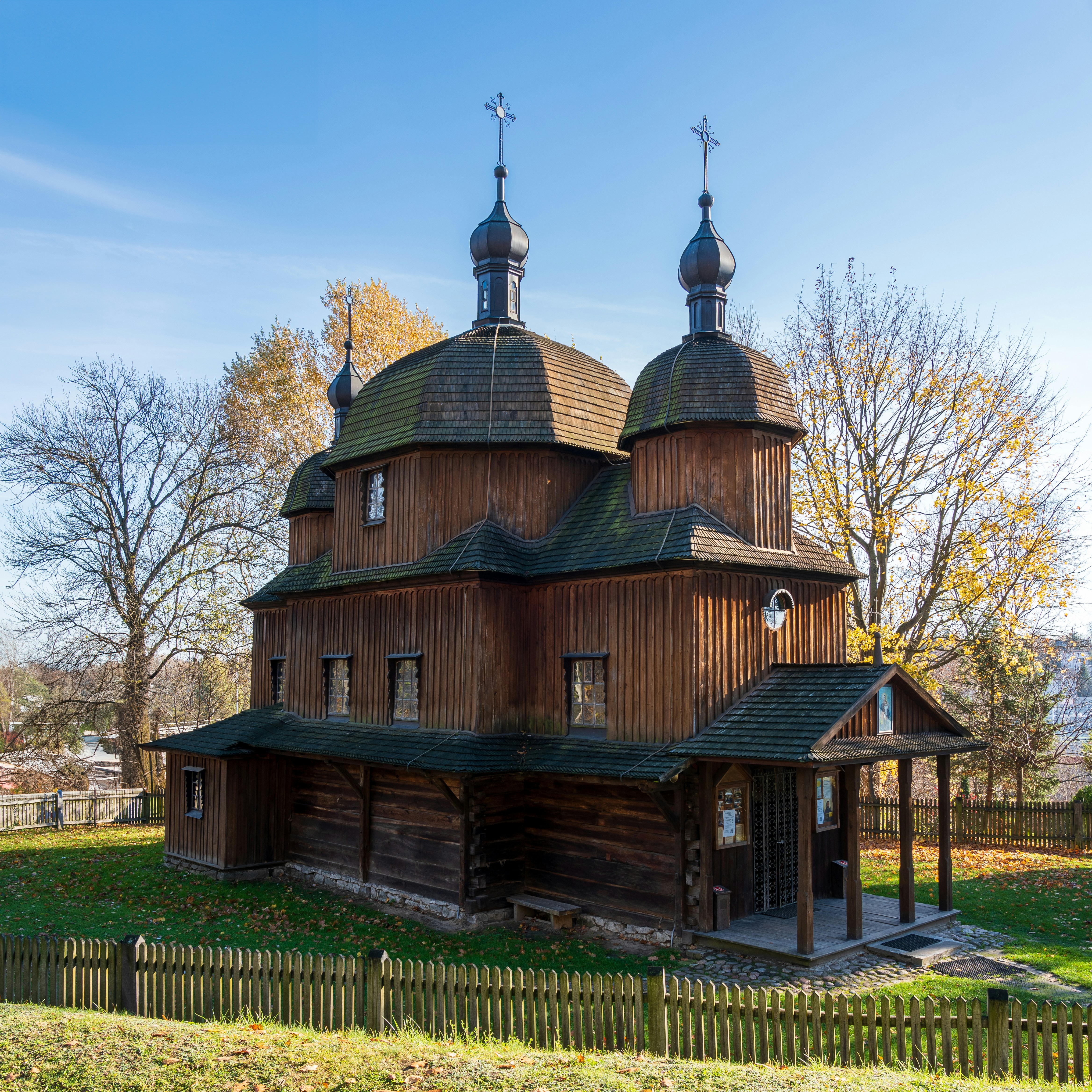 a large wooden building with two towers on top of it