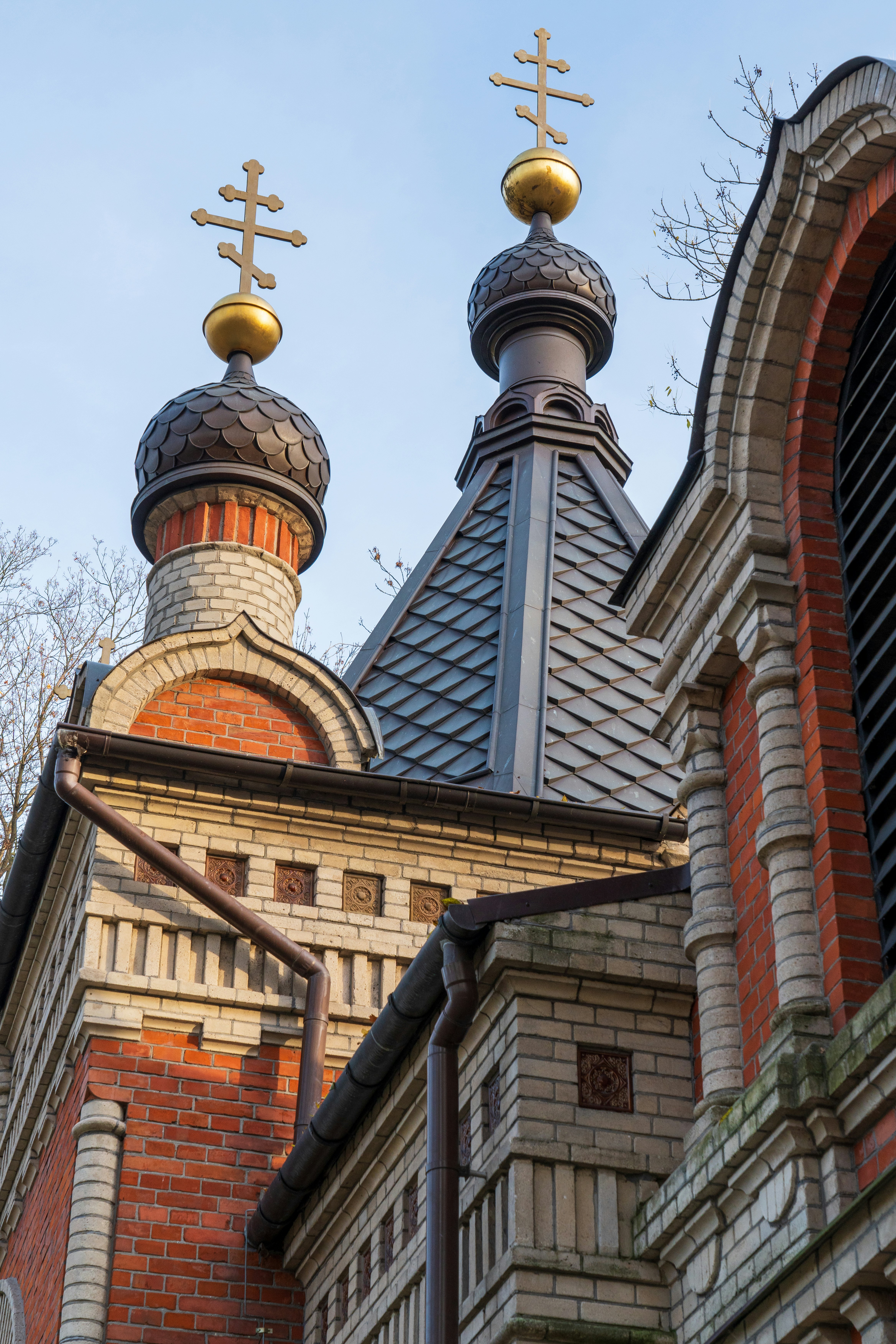 a building with two towers and two crosses on top of it