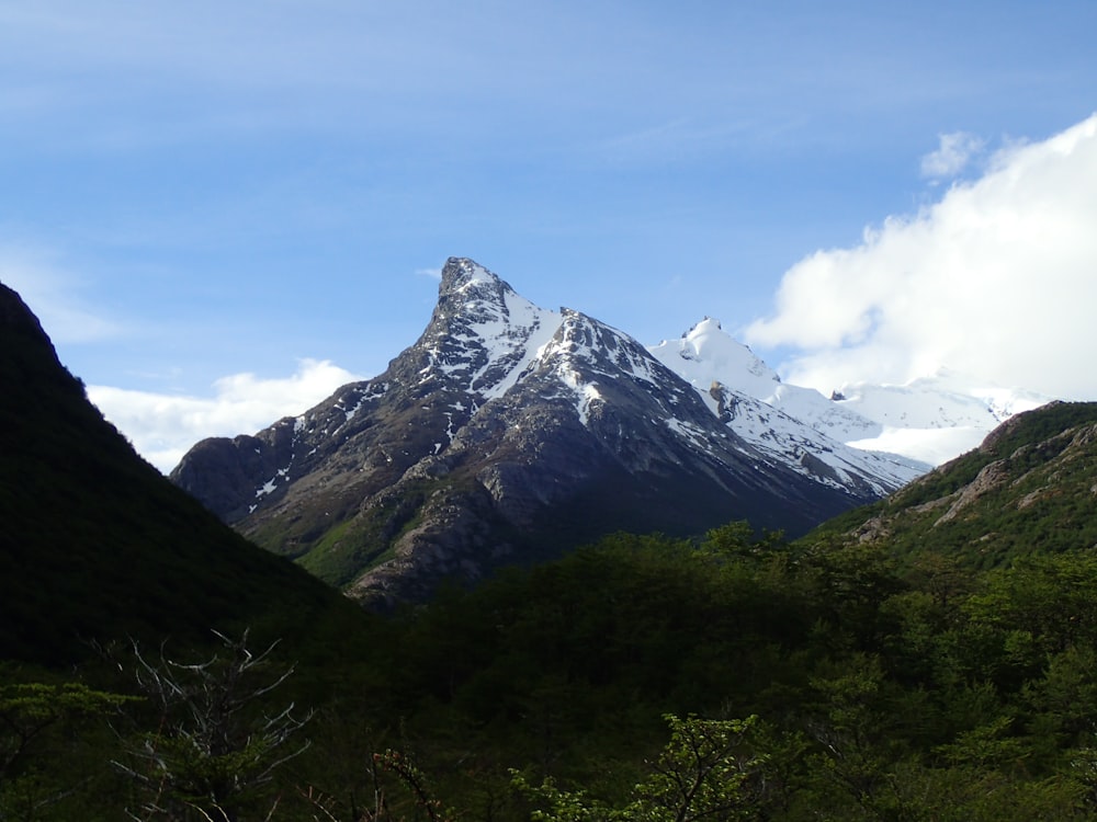 a view of a snowy mountain in the distance