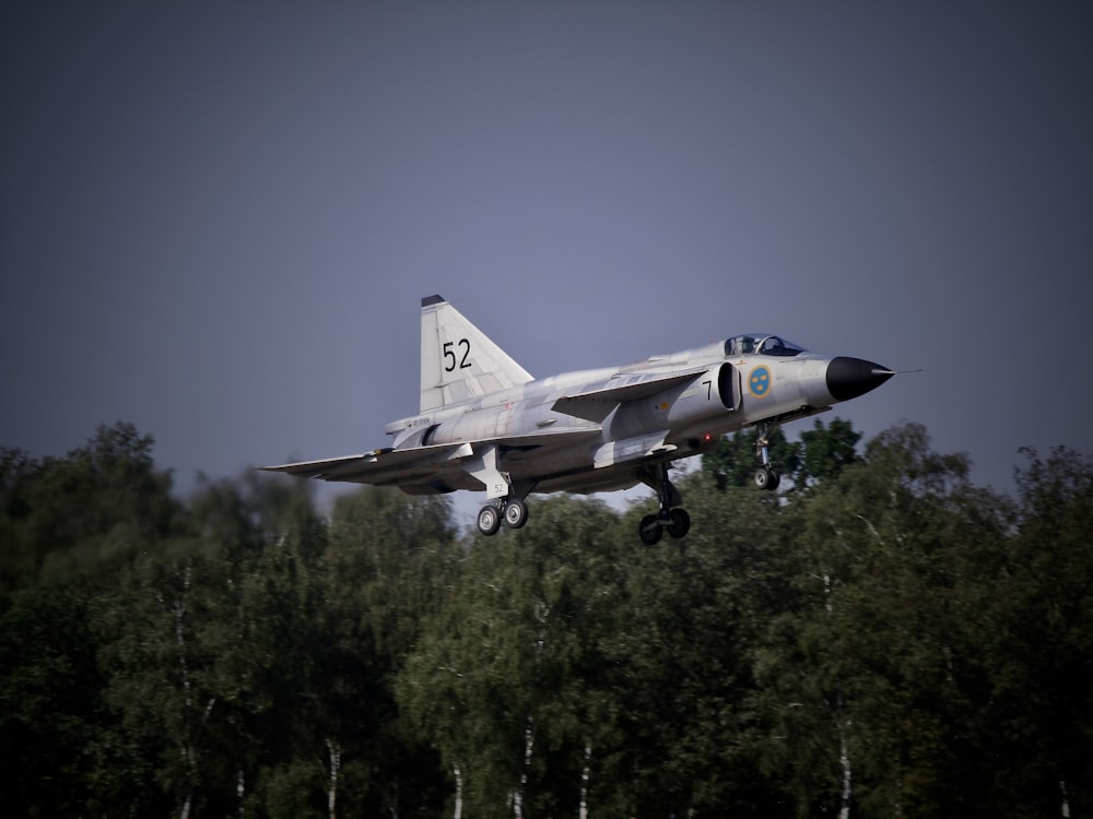 a fighter jet taking off from a runway