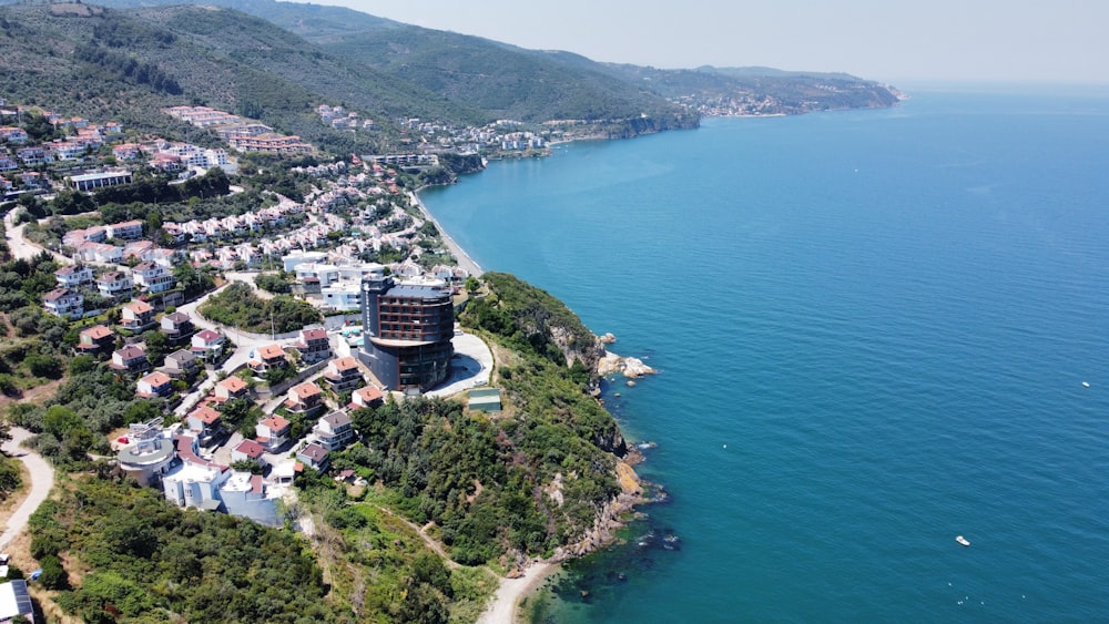 a bird's eye view of a city next to the ocean