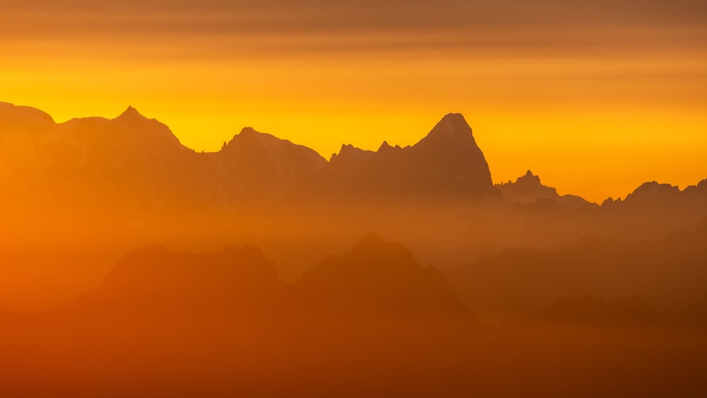 a view of a mountain range at sunset