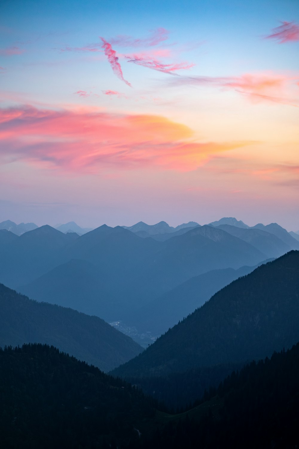 a view of a mountain range at sunset