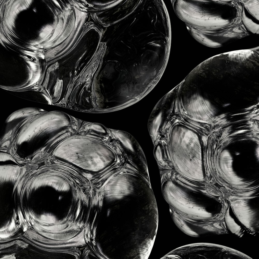 a group of glass bowls sitting on top of a table