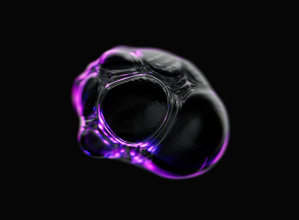 a black and purple object with a black background