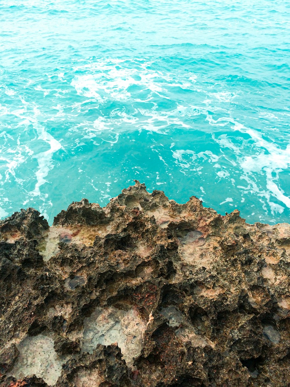 a view of the ocean from a rocky outcropping