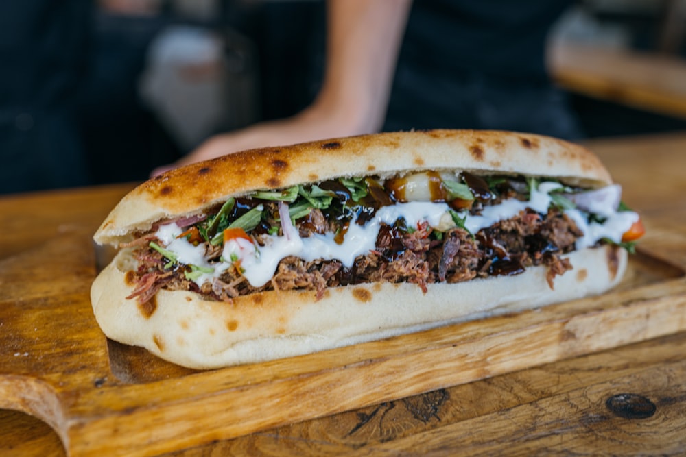 a close up of a sandwich on a cutting board