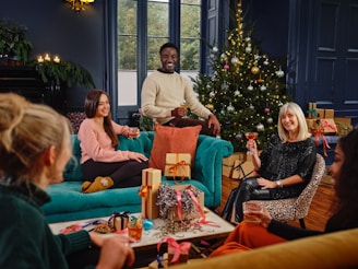 A cheerful group of friends exchanging gifts in a cozy living room.