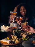 a group of people toasting with drinks