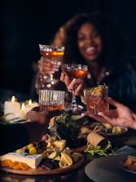 a group of people toasting with drinks