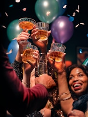 a group of people holding up glasses of wine