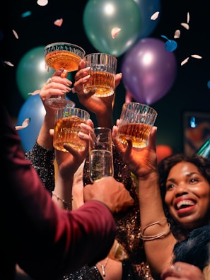 A diverse group of people celebrating a financial milestone.