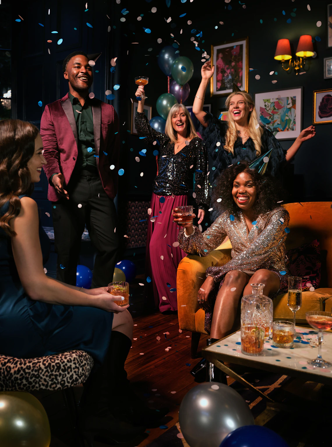 Guests celebrating together with confetti, balloons, and polished party styling