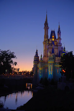 A dreamy pastel illustration of a fairy tale castle surrounded by twinkling stars and gentle sparkles.