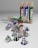 Several cylindrical cardboard tubes and coffee capsules in green, blue, and maroon are seen. The tubes are standing upright and lying on their side, with some capsules scattered around. The capsules are metallic and have bold lettering.