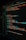 A close-up view of a computer screen displaying HTML and CSS code for a login form. The code includes elements like head, body, various input fields for username and password, and linked style sheets. The text is primarily in blue, white, orange, and green, set against a dark background.