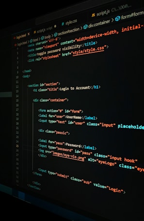 A close-up view of a computer screen displaying HTML and CSS code for a login form. The code includes elements like head, body, various input fields for username and password, and linked style sheets. The text is primarily in blue, white, orange, and green, set against a dark background.